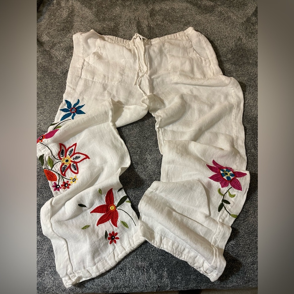 Lightweight white pants. Brand is Chicos, waist is a 32. Only worn twice.